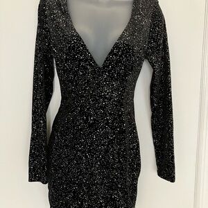 Women’s black glittered design dress.  Low cut front. Size L NWT